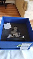 Figurine in original blue Swarovski box showing foam insert
