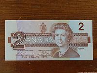 Front of 1986 Canadian two dollar bill showing Queen Elizabeth II and series year 1986