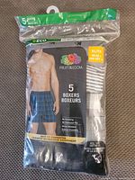 Photo of Fruit of the Loom men's boxers 5-pack size XL in packaging, showing assortment of patterns and brand label.