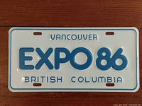 Full front view of the Expo 86 license plate showing text and condition.