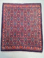 Top view of the hand knotted Persian wool rug showing the full design and borders, emphasizing the colors and pattern.