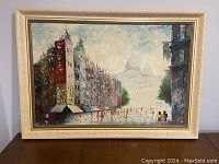 Front view of the framed impressionist cityscape oil painting showing the full artwork and frame.