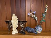 Full lot display showing all items together on a wood shelf against paneled wall