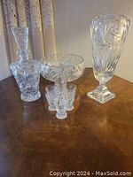 Full lot arrangement showing tall vase, decanter, large bowl with small bowl inside, and six small glasses