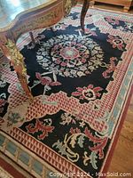 Full view of rug under table, showing overall pattern and color scheme