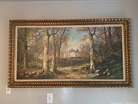 Front view of the framed oil painting depicting a forest scene with a house in the distance.
