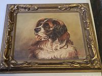 Full view of the framed oil painting showing a dog's portrait.
