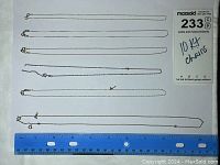 Top view of all five gold chains laid flat next to a blue ruler showing length, demonstrating four 16-inch and one 20-inch chains. Some chains have visible breakage and wear.