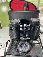 Nikon camera and Sans & Streiffe binoculars, binoculars in case