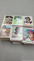 Top view of multiple stacks of 1978 Topps Baseball Cards with visible individual player cards on top, showing image and team.