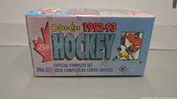 Front of sealed O-Pee-Chee 1992-93 hockey card box showing complete set label