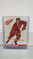 Front of 1954 Topps Benny Woit Detroit Red Wings hockey card inside plastic sleeve