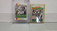 Front view of the 1973 Topps OJ Simpson football card and 1977 Topps Bob Griese football card side by side showing condition and colors.