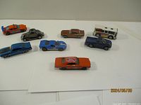 Top-down view of all seven die-cast cars showing size and colors.