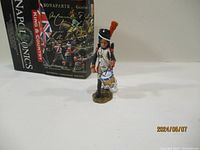 Front view of the drummer figure with box in background