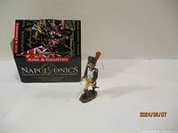 Napoleonic soldier figurine with box in background