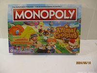 Front view of Monopoly Animal Crossing New Horizons Edition board game box showing game title and themed artwork.