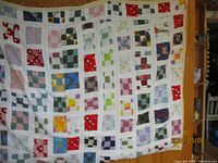 Full view of patchwork quilt showing size and pattern.