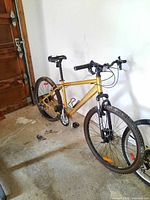 Side view of the full bike showing frame, tires, seat, and handlebars