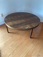 Top view showing the round wooden tabletop with visible wood grain and smooth surface.