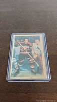 Front of 1953-54 Parkhurst Jim McFadden hockey card showing player in uniform.