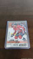 Front of Alex Ovechkin NHL Journey hockey card serial numbered 613/799 in protective case