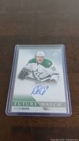 Front side of Devin Shore Future Watch Autograph hockey card with player photo and blue ink signature.