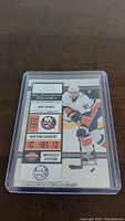Front side of John Tavares hockey card in protective sleeve, showing player image and team details.