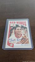 Front of the autographed Ted Lindsay hockey card showing his portrait and autograph.