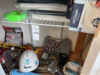 Overview of items including helmet, nylon filament coil, plastic sheets, pneumatic tool, and electrical wire.