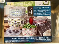 Box front showing 4 microwavable bowls with lids stacked, decorated with colorful patterns.