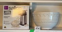Salton Cinema Popper popcorn maker in original box with accompanying ceramic popcorn bowl showing popcorn text detail.