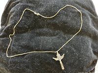 Full view of chain with pendant on black felt