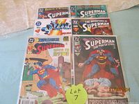 View of all six Superman comics laid out, showing front covers and bagged/boarded condition