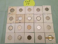 Full view of 20 Canadian nickels in protective holders, showing dates from 1934 to 1979. Includes bronze colored 1942 and 1943.