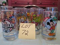 Front view showing all five glasses in the set, each with different character artwork.