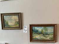 Two framed vintage oil paintings on board, hung on a wall showing full view of both paintings and their frames.