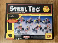 Front of the closed Steel Tec set box showing brand name, number of pieces (339), and example models that can be constructed.