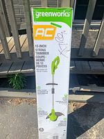 Image of Greenworks AC 13-inch string trimmer box, front view showing product image and key features.