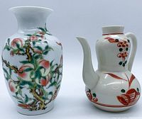 Two Japanese porcelain vases side by side, showing overall appearance and design detail.