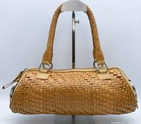 Front view of Cole Haan woven leather mini Boston handbag in tan, showing woven mesh texture and braided handles.
