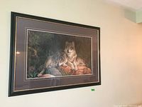Full view of the framed art print of wolves showing overall condition and size
