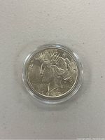 Obverse side of 1922 Peace Silver Dollar showing Liberty's head and date.