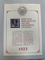 Display card with a mounted 1923 Liberty coin and attached John Logie Baird stamp with text about his contributions to experimental television.