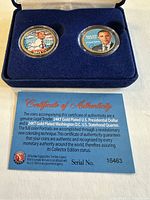 Two 24kt gold plated coins featuring Obama in a blue velvet-lined case with certificate of authenticity included beneath.