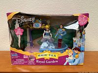 Front view of the boxed Disney Magic Talk Royal Garden set with Cinderella and Prince Charming figurines visible.