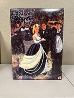 Front view of the Barbie doll box with illustrated ballroom dancing scene and Midnight Waltz branding.