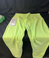Front and back view of brand new Lululemon Align lined leggings, size 10, 28 inch inseam in light yellow-green color with tags attached