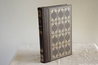 Front and part of spine of leather-bound Sir Walter Scott "Waverley" book with gold embossing.