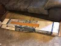 Two full boxes of Mirage Classic solid pre-finished hardwood flooring on the floor.